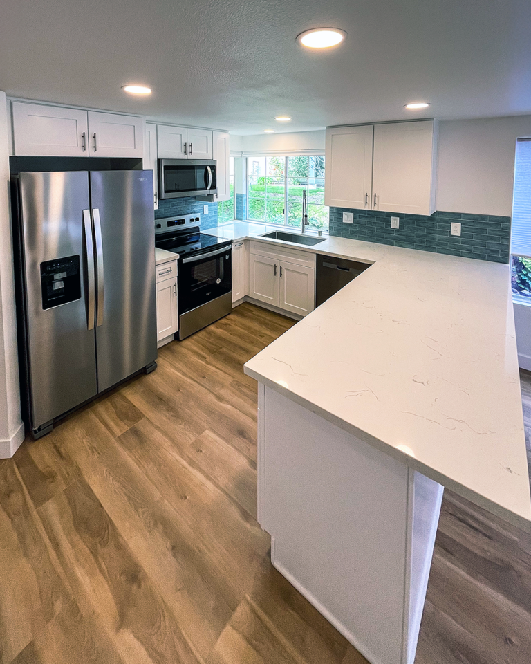 Clairemont Kitchen Remodel with White Cabinets and Wood Look Flooring